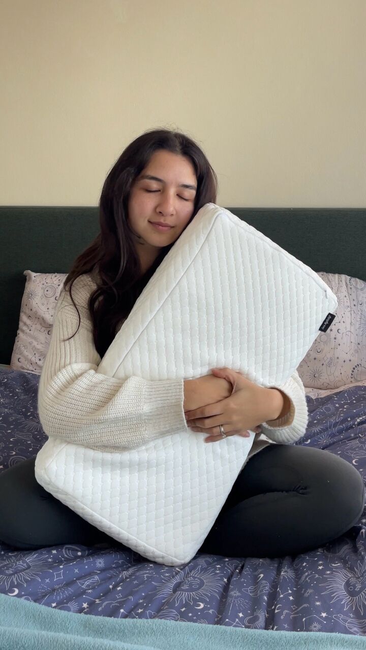 side-sleeper-pillow-cube-australia-sitting-on-bed
